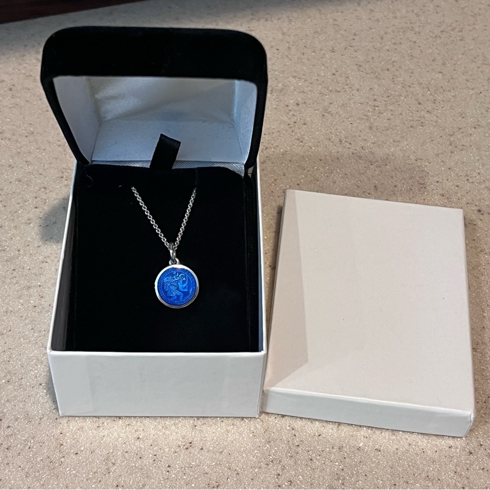 Never worn Saint Christopher enamel and Sterling silver metal with chain.